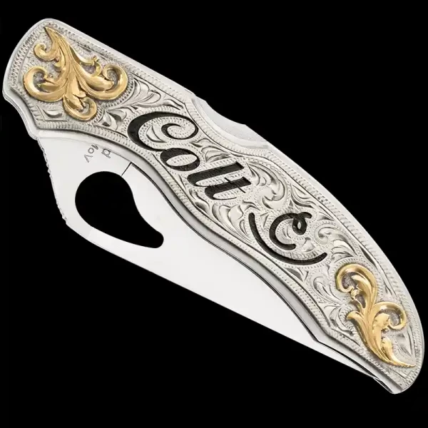 "Our Coyote Dawn custom knife is a true masterpiece of craftsmanship, designed to elevate any collection. 
This custom-made knife is crafted using a SpyderCo Byrd knife and a German Silver plate. The German Silver plate is hand-engraved & finish